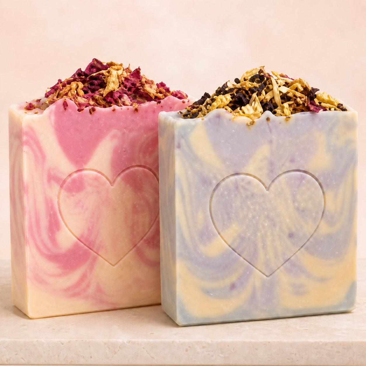 Handmade artisan soap bars with heart designs and dried flowers