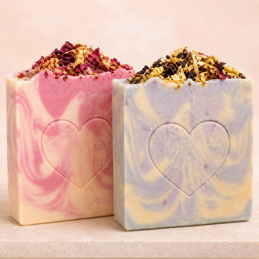 Handmade artisan soap bars with heart designs and dried flowers