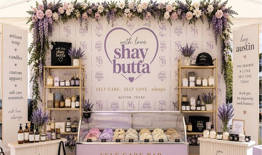 With Love, Shay Butta booth with handmade soaps, candles and body care on display